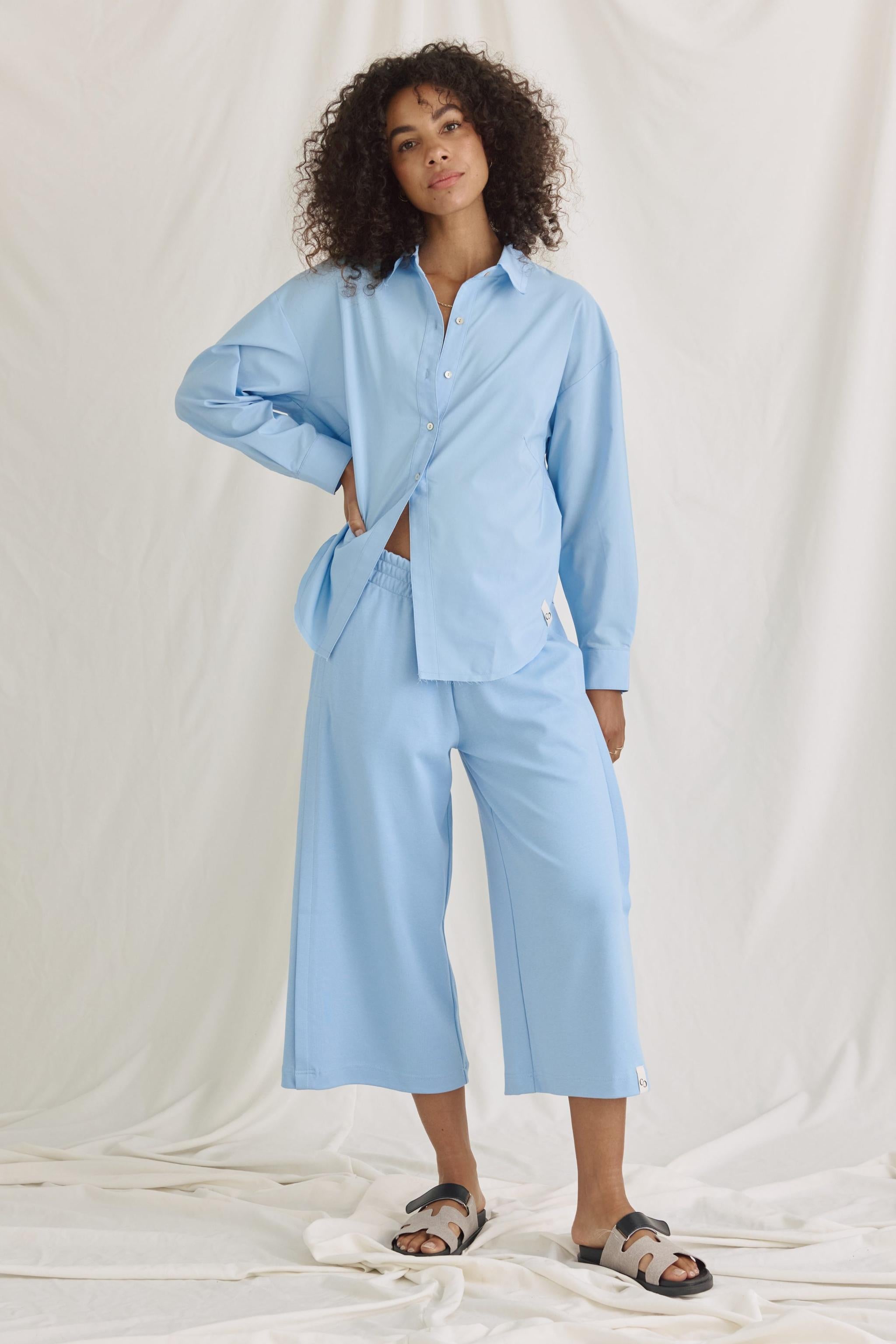 Bluse Mit Verkürztem Rücken Und Volants
