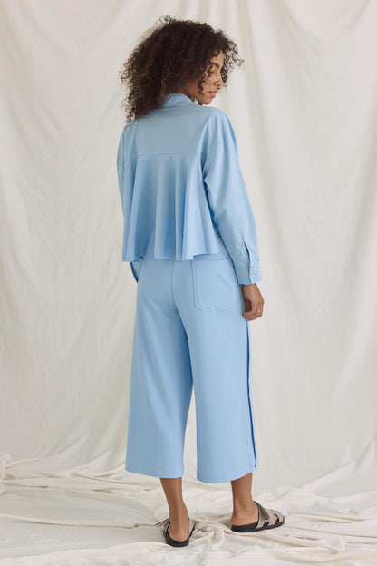 Bluse Mit Verkürztem Rücken Und Volants